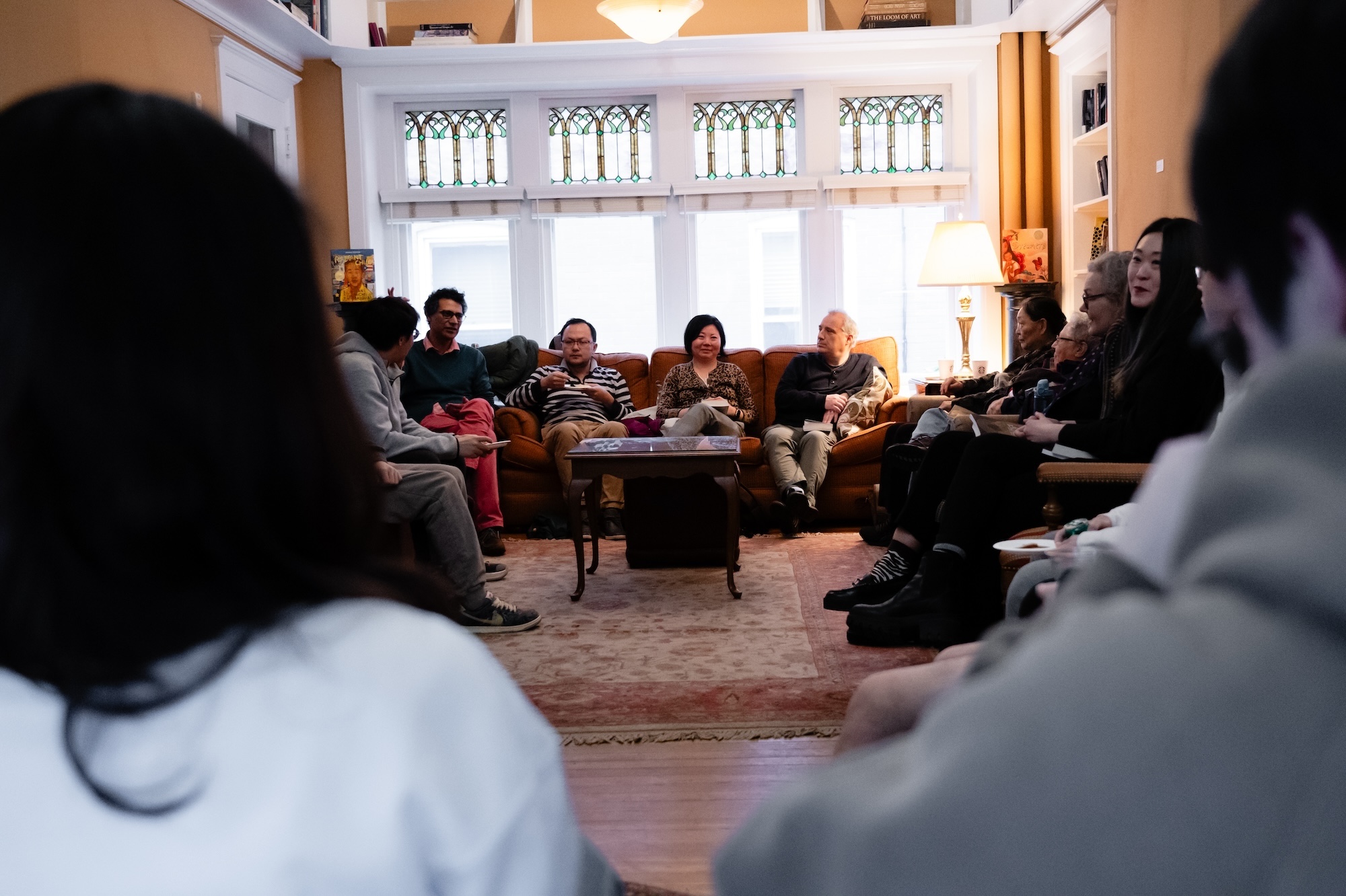 Students and faculty discuss sci-fi stories in the living room of the Humanities Center