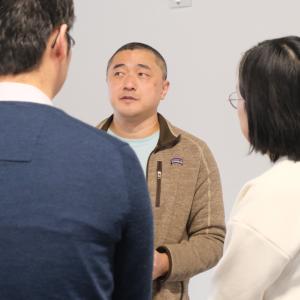 Author Ken Liu talks to two people