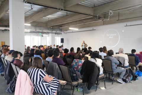 Ken Liu talks to a crowd in the HST building